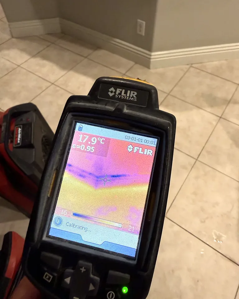 Thermal imaging camera showing hidden moisture under a tile floor